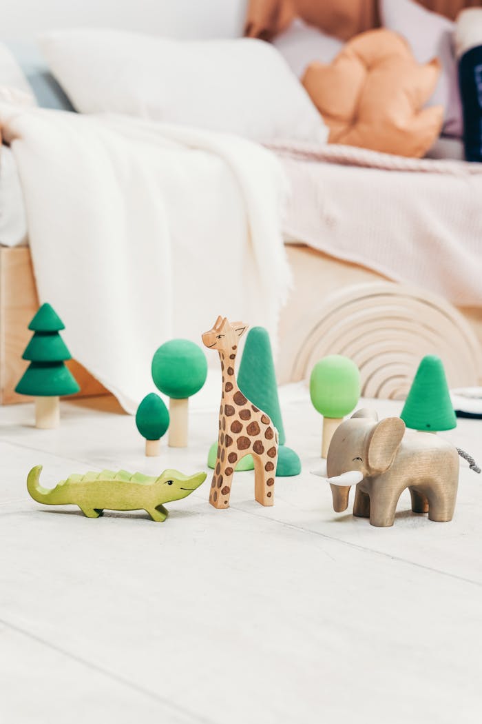 Minimalist playroom with wooden animal toys, perfect for creative child engagement.